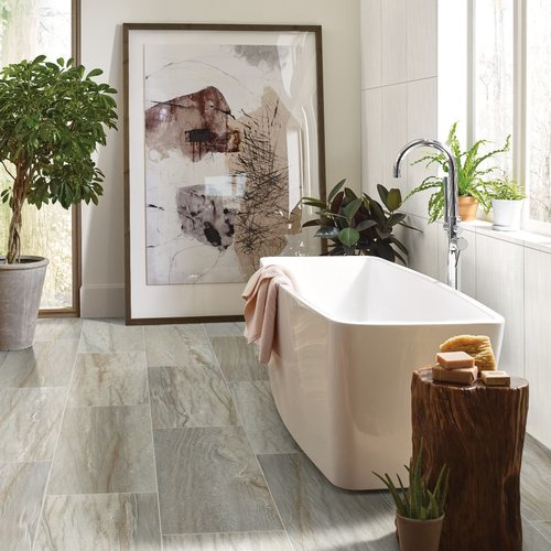 white bathtub with gray tile floor from Katy Carpets in Katy, TX